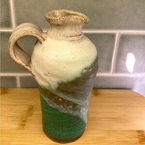 Handmade pottery pitcher in green white and tan for kitchen use and decor